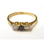 SAPPHIRE & DIAMOND TRILOGY RING Central cushion cut 'cornflower' blue sapphire approx 0.18 carats,
