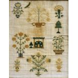 A 19TH CENTURY SAMPLER undated, incorporating mainly floral and foliate motifs, with a bird and a