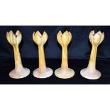 A SET OF FOUR ART POTTERY CANDLESTICKS, 24.5cm high, possible American Condition Report : good