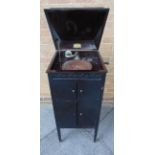 A MUSOLA CABINET GRAMOPHONE the ebonized case with a record storage compartment, overall 96.5cm