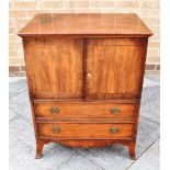 A MAHOGANY COMMODE fitted with cupboard above two faux drawers, on splayed bracket feet, 62cm wide