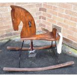A 'RETRO' WOODEN AND IRON ROCKING HORSE 77cm high, 90cm long Condition Report : generally good, some