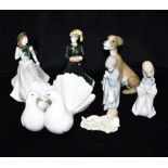 A GROUP OF LLADRO ITEMS 01004583 Seated Dog; 1169 pair of doves group; pair of boy and girl figures;
