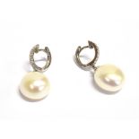 WHITE GOLD DIAMOND AND PEARL EARRINGS 2.5cm long consisting of 18ct white gold grain set hinged
