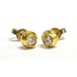 DIAMOND & 18CT GOLD STUD EARRINGS 5.7mm diameter raised gold studs with invisibly set diamonds,