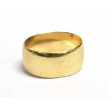 WIDE PLAIN GOLD WEDDING BAND 9.8mm wide, 9ct gold, indistinct hallmark, ring size R. Slightly bent