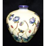 A MOORCROFT POTTERY 'HEPATICA' PATTERN VASE impressed and painted marks to base, dated '99, 18cm