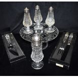 A WATERFORD CRYSTAL CAKESTAND 25cm diameter, boxed cake knife, boxed carving set, and four casters