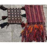 A SMALL HANDWOVEN BAG FACE 36cm x 42cm; and another larger striped example with long tassels, 58cm x