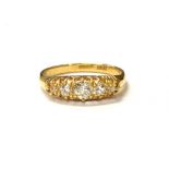 ESTATE DIAMOND FIVE STONE 18CT GOLD RING Five belcher claw set old European cut diamonds,