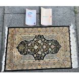 A SMALL SILK RUG, 70cm x 110cm, with associated paperwork Condition Report : good condition