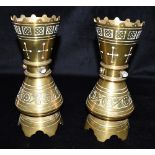 A PAIR OF VICTORIAN GOTHIC REVIVAL BRASS VASES in the manner of AWN Pugin, of waisted form, each