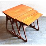 A NEST OF THREE DANISH TEAK OCCASIONAL TABLES the largest 57.5cm x 39cm, 49cm high, stamped to