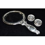 EDWARDIAN SILVER MIRROR AND CRYSTAL POTS Mirror 28cm long with repousse work to back depicting