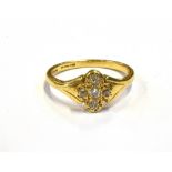 ESTATE DIAMOND CLUSTER RING A 9.0 x 8.0mm quatrefoil shaped head, grain set with five old cut