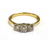 MODERN THREE STONE DIAMOND RING Central modern brilliant cut diamond approx 4.6mm flanked by two 4.
