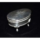 EDWARDIAN SILVER FOOTED POWDER POT Oval monogrammed hinged lid on cabriole legs, stands 4.3cm