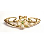 ART NOUVEAU WHITE OPAL & PERIDOT BROOCH 3.6cm long of flowing ribbon design, with a centre piece