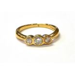 18CT GOLD AND DIAMOND TRILOGY RING Three round brilliant cut diamonds, chenier set, approx TDW 0.