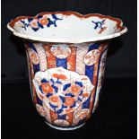 A LARGE IMARI VASE with lobed and flared rim, typically decorated with foliate sprays, 30cm high