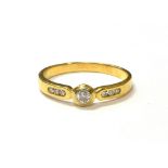 MODERN DIAMOND 18CT GOLD DRESS RING Bezel set round brilliant cut diamond, estimated 0.17 carats,