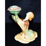 A CLARICE CLIFF BIZARRE 'MY GARDEN' FIGURAL CANDLESTICK modelled as a kneeling female holding