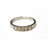 MODERN FIVE STONE DIAMOND ETERNITY RING Five round brilliant cut diamonds, estimated to total 0.25