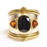 THEO FENNELL SAPPHIRE BOMBE RING Handmade ring in 18ct yellow gold with rhodium plating to centre of