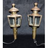 A PAIR OF BRASS CARRIAGE LAMPS converted to electric wall lights, 27cm high