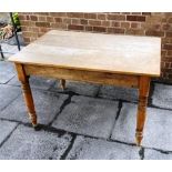 A PINE AND BEECH KITCHEN TABLE with four plank beech top, on pitch pine base with frieze drawer to