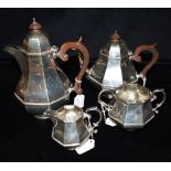 ART DECO SILVER TEA & COFFEE SERVICE Of geometric form with brown celluloid handles and finials,