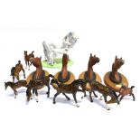 A GROUP OF BESWICK HORSE FIGURES: four plaques 'Red Rum', 'Arkle', 'Troy', 'The Minstrel' and