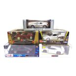 FIVE ASSORTED 1/18 SCALE PORSCHE DIECAST MODEL CARS each mint or near mint and boxed (one model