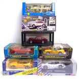 FIVE ASSORTED 1/18 SCALE PORSCHE DIECAST MODEL CARS each mint or near mint, all but one boxed (one