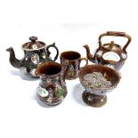 A COLLECTION OF MEASHAM BARGEWARE: a teapot on stand, another teapot, a jug, bowl and tankard,