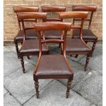 A SET OF SIX LATE VICTORIAN MAHOGANY RAIL BACK DINING CHAIRS with drop-in seats, on turned