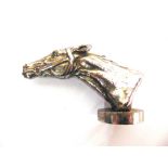 AUTOMOBILIA - A CHROMED CAR MASCOT IN THE FORM OF A RACEHORSE'S HEAD the circular base marked '