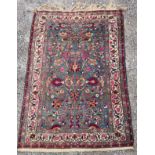 A BLUE GROUND RUG the central field with birds amongst foliage, 140cm x 205cm Condition Report :