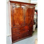 AN EARLY 19TH CENTURY MAHOGANY LINEN PRESS the moulded cornice above pair of doors opening to five