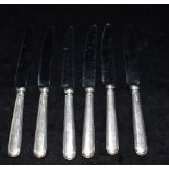 SIX SILVER HANDLED KNIVES Set of six side knives, hallmarked Sheffield 1975. Total weight 329.4