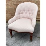 A VICTORIAN UPHOLSTERED ARMCHAIR BY HOLLAND & SONS with button upholstered back and serpentine front