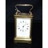 CARRIAGE CLOCK BY CHARLES FRODSHAM & CO Brass case stands 12.5cm tall, with five bevelled glass