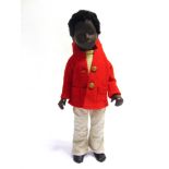 A SASHA BOY DOLL, CALEB with black hair, wearing a pale yellow roll-neck pullover, pale grey