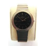 A PORSCHE DESIGN WRISTWATCH, BY I.W.C. the black face with baton hour markers and date aperture at
