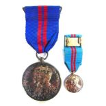 A DELHI DURBAR MEDAL, 1911 unnamed as issued, brooch-mounted for wearing; together with a