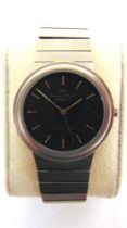 A PORSCHE DESIGN WRISTWATCH, BY I.W.C. The black face with baton hour markers and date aperture at