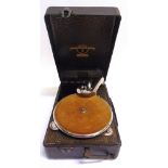 A COLUMBIA NO.100 PORTABLE GRAMOPHONE with a Columbia reproducer, in a black rexine covered case;