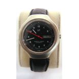 A PORSCHE DESIGN WRISTWATCH the black face with Arabic numerals and day/date aperture at 3, the