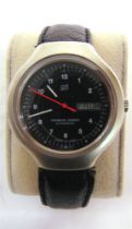 A PORSCHE DESIGN WRISTWATCH the black face with Arabic numerals and day/date aperture at 3, the