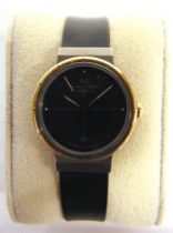 A PORSCHE DESIGN LADY'S WRISTWATCH, BY I.W.C. the black face with date aperture at 6, the titanium